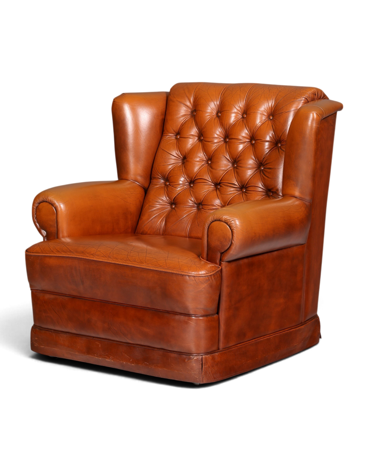 Hauptstadt Möblerei Chesterfield Sessel aus cognacfarbenem Echtleder mit klassischer Knopfheftung und Rollen