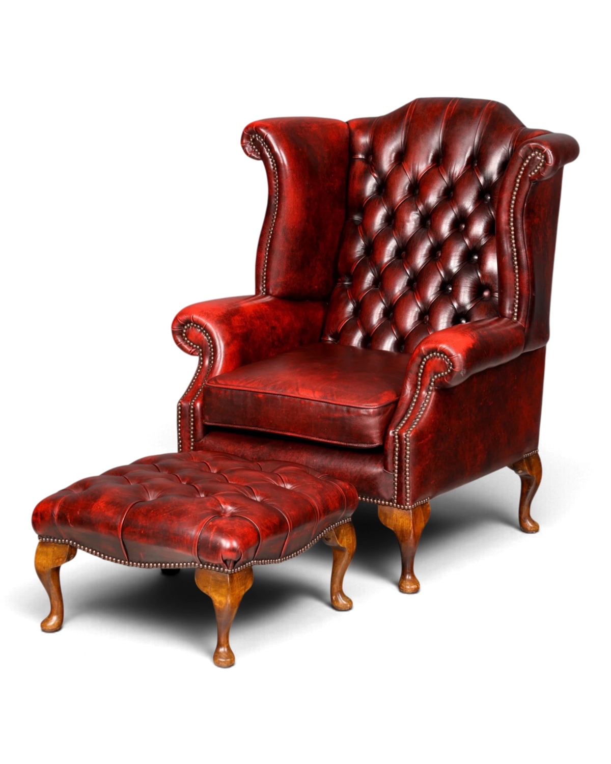 Original Chesterfield Queen Anne wingback armchair with footstool, oxblood English genuine leather gentleman's chair, UK armchair with armrests